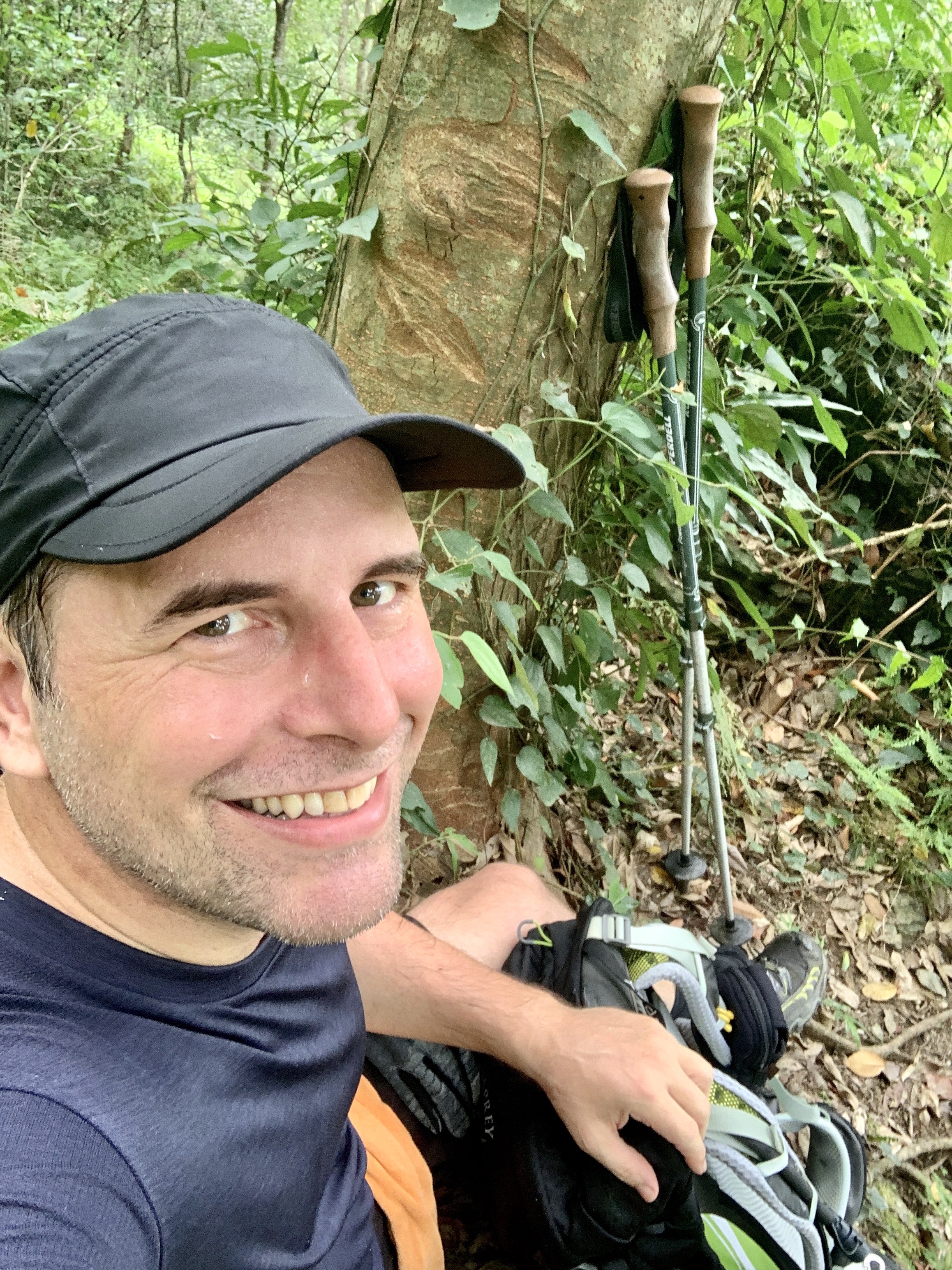 Man sitting on wooded trail